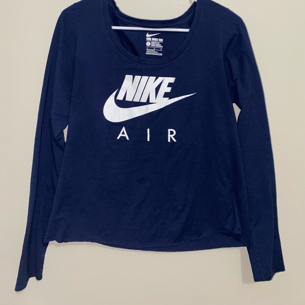 Dark blue Nike long sleeve shirt. Women’s size large but fits like a medium.